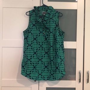 Geometric print tunic with ruffle neckline.